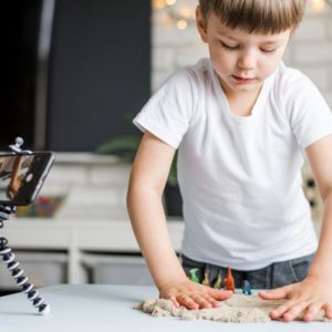 medium-shot-kid-playing-with-sand_23-2148551537